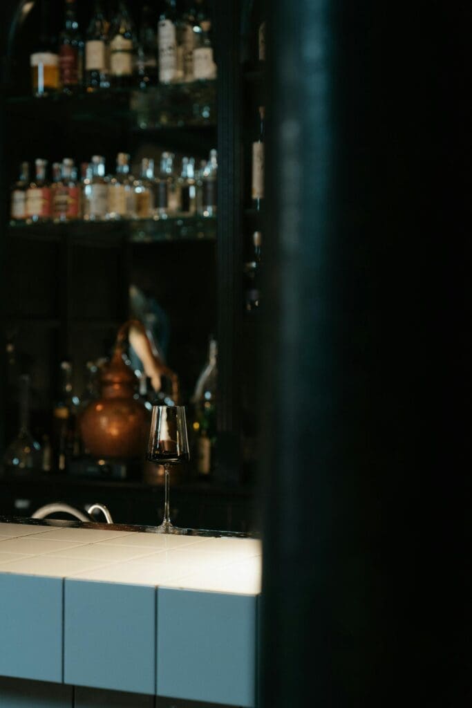 Filled wine glass waiting to be served to the customer